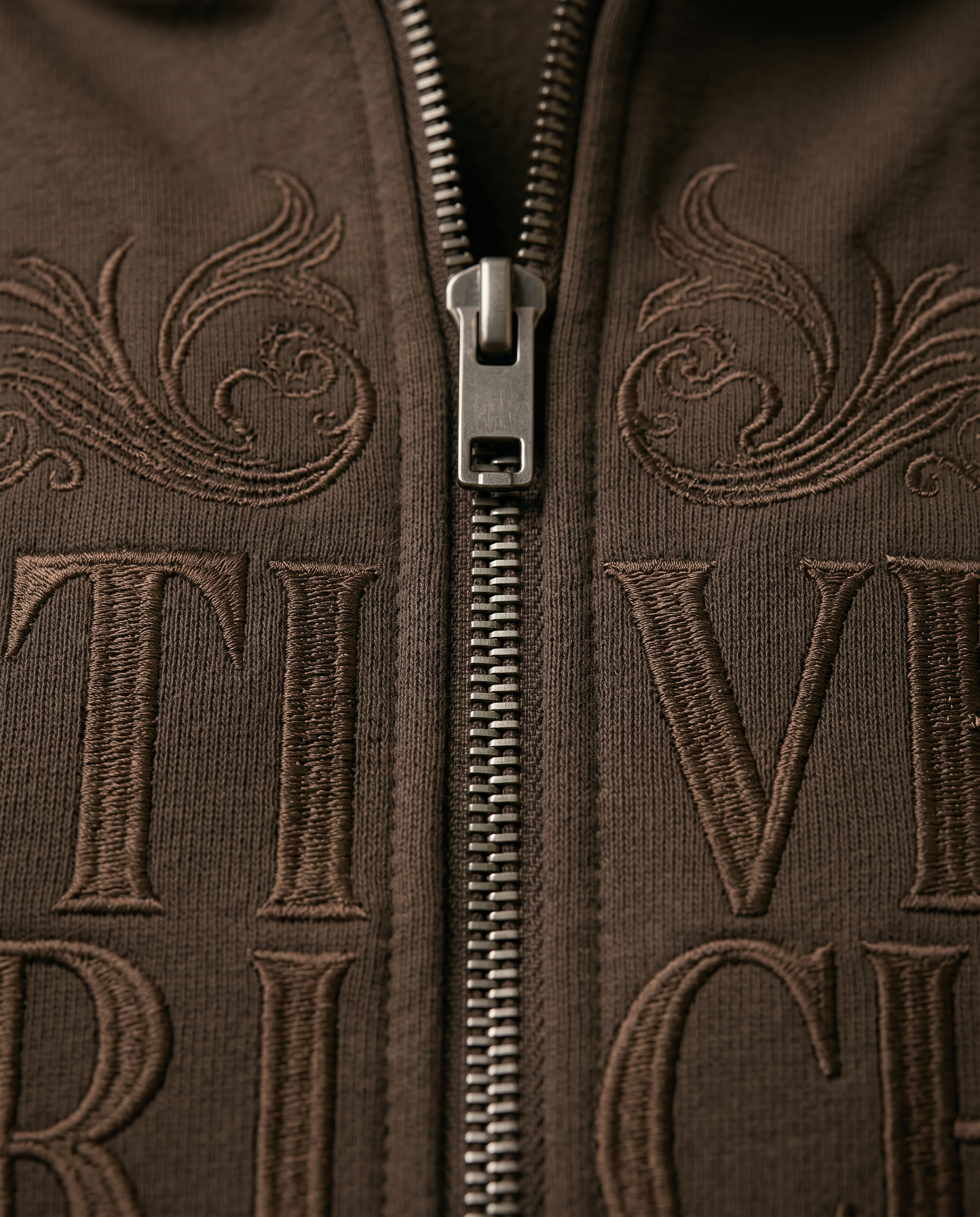 Actively Rich Ascension Noir luxury streetwear expresso brown hoodie macro detail showing tonal embroidered logo and metal zipper closure