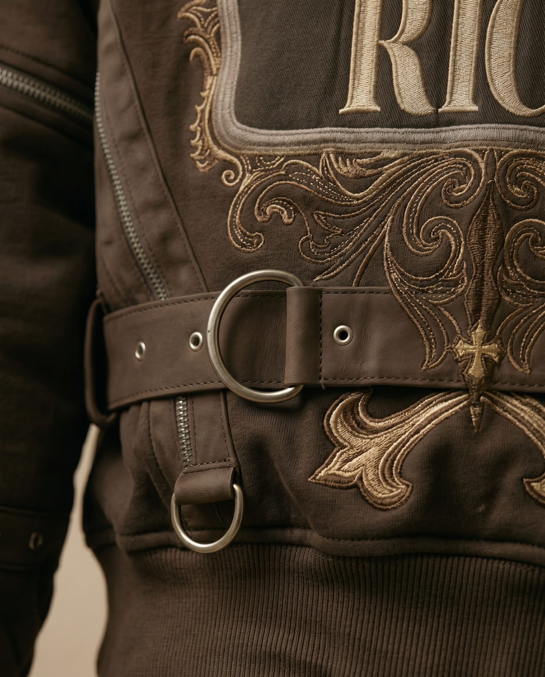 Actively Rich Ascension Noir luxury streetwear expresso brown hoodie showcasing premium hardware rings, belt detailing, and intricate embroidery craftsmanship
