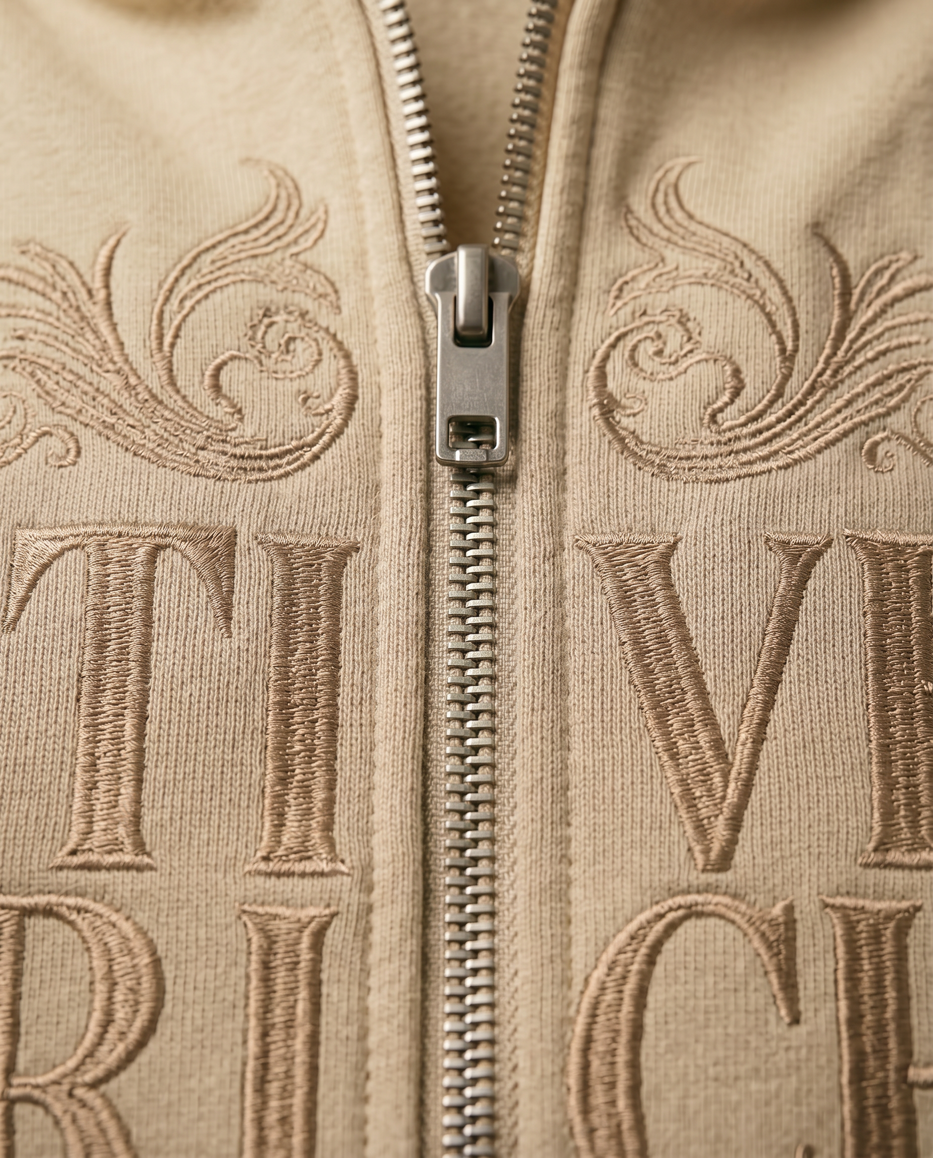 Actively Rich Ascension Noir luxury streetwear ivory cream hoodie showing premium zipper hardware and tonal embroidered log detailing
